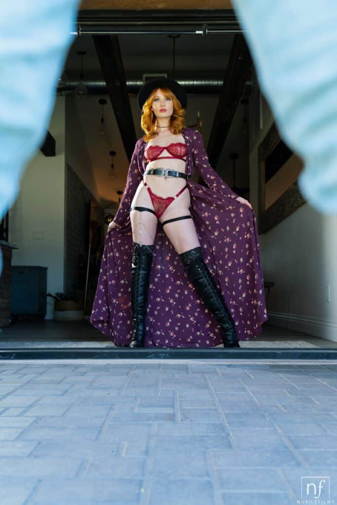 Beautiful ginger girl wears sexy lingerie and knee high boots while fucking