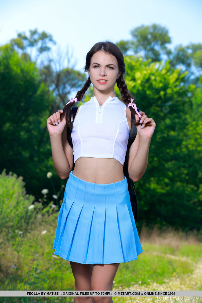 Schoolgirl Feolla stops in the field on the way home to strip off