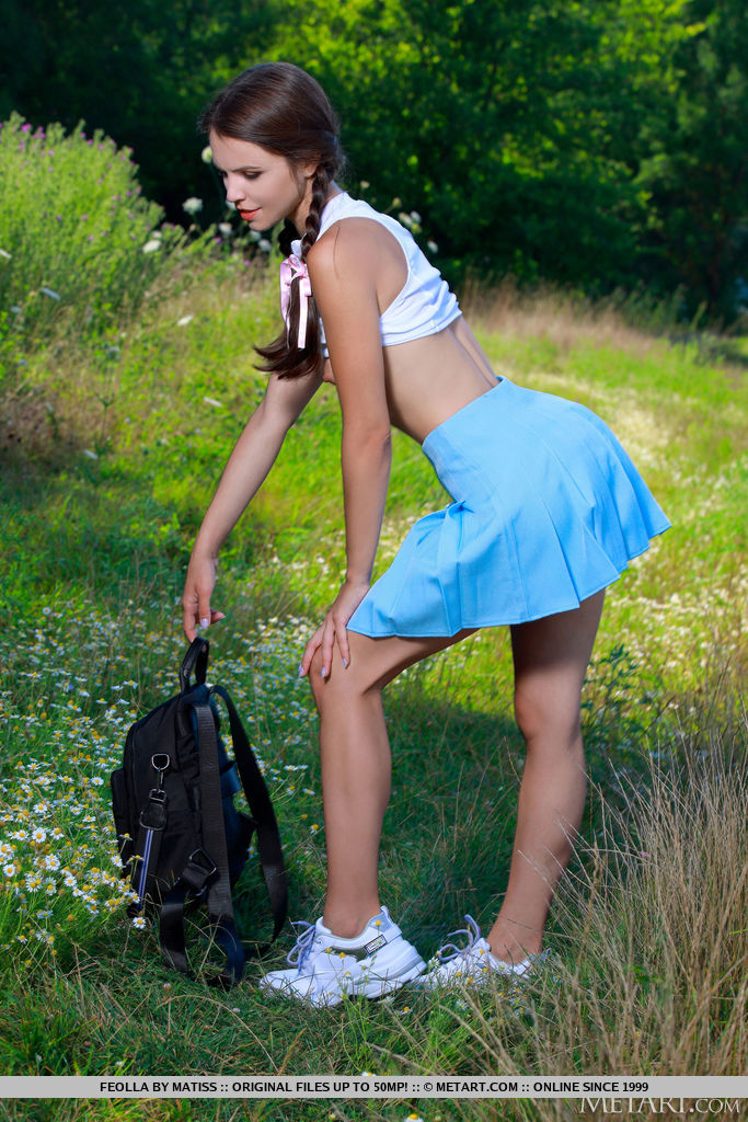 Schoolgirl Feolla stops in the field on the way home to strip off